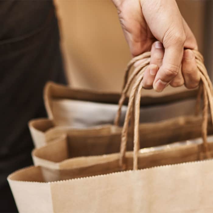 person-holding-grocery-bags
